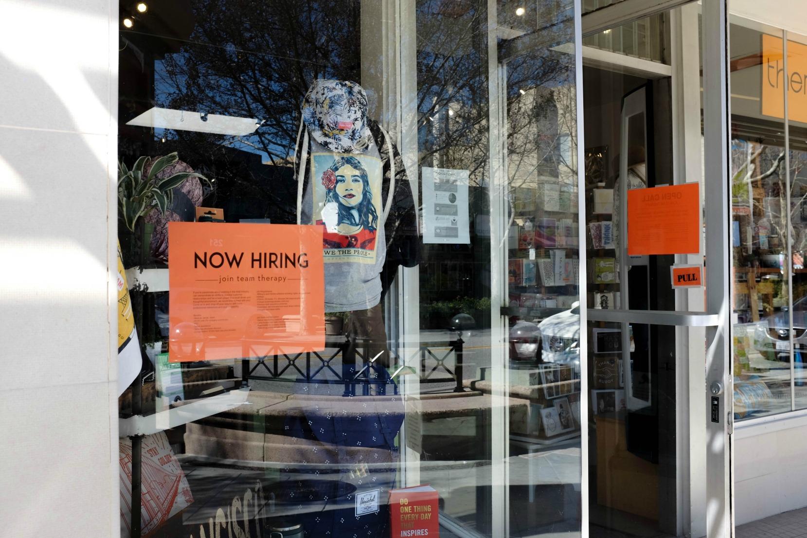 A sign on the window of boutique store Therapy in Mountain View reads