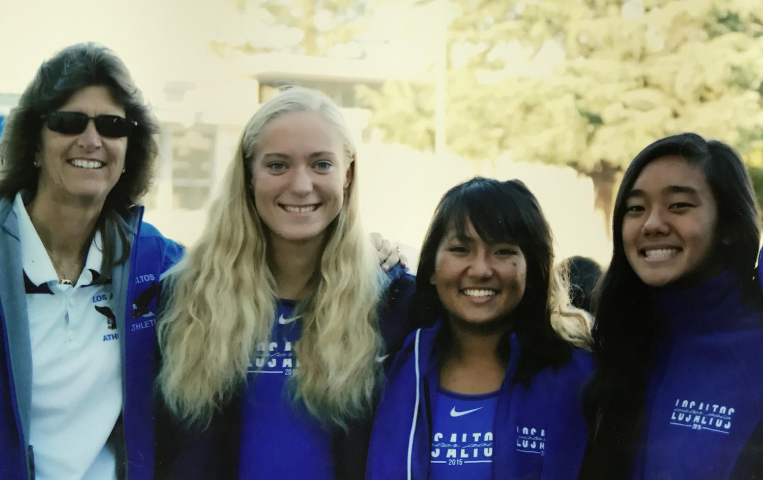 Athletic Director Kim Cave (left) poses with senior water polo players during Senior Night last year. Cave will retire at the end of this school year after serving as athletic director and P.E. teacher for 11 years. Photo courtesy Ellen Roper.