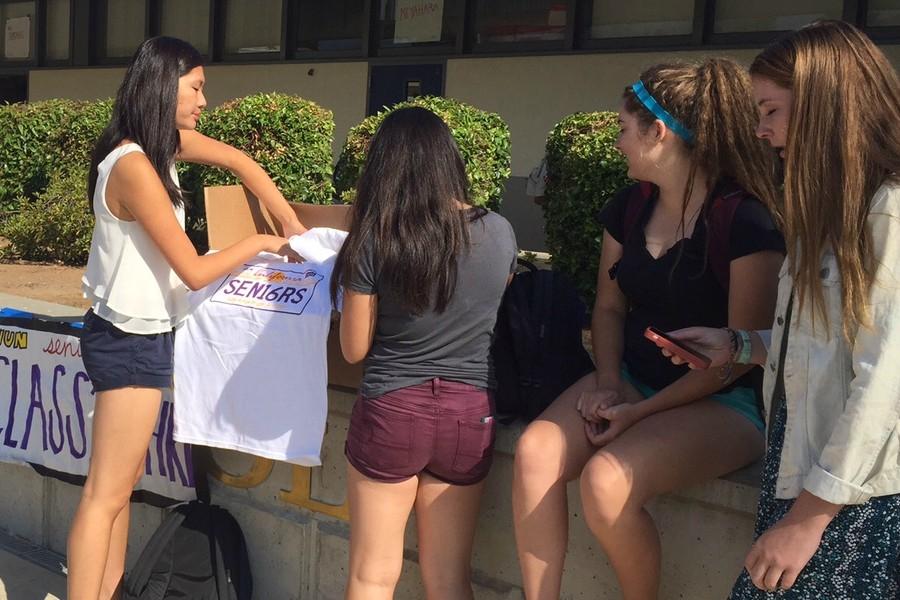 Seniors Jenny Chin, Izzy Phan, Sonja Koblas and Meg Enthoven (left to right) sell T-shirts. The sale will end on August 20.
Photo by Emily Terada.
