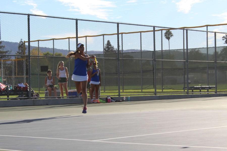 Senior Juliette Martin swings at the ball. Photo by Kevin Yen.