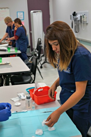 LAHS alumna Jessica Luna '09 completes work for her Medical Assistant program. Photo by Michael Sieffert.