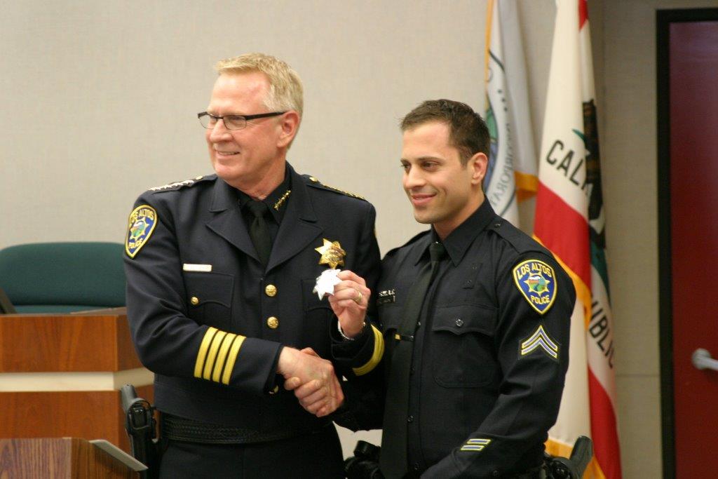 School Resource Officer Ryan Langone (right) is promoted to Agent status and shakes hands with Los Altos Police Chief Tuck Younis (left). In September, Langone was appointed to the School Resource Officer position. Photo courtesy Ryan Langone.