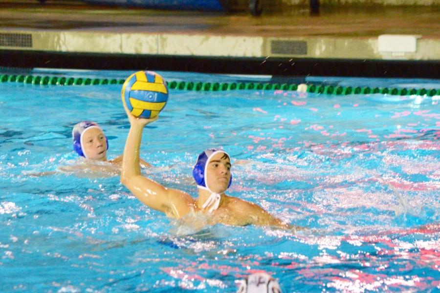 Junior+Scott+Cairns+winds+up+to+shoot.+With+a+late-season+push%2C+the+boys+water+polo+team+made+it+into+the+CCS+playoffs+before+losing+their+second-round+game.+Photo+by+Kunal+Pandit.