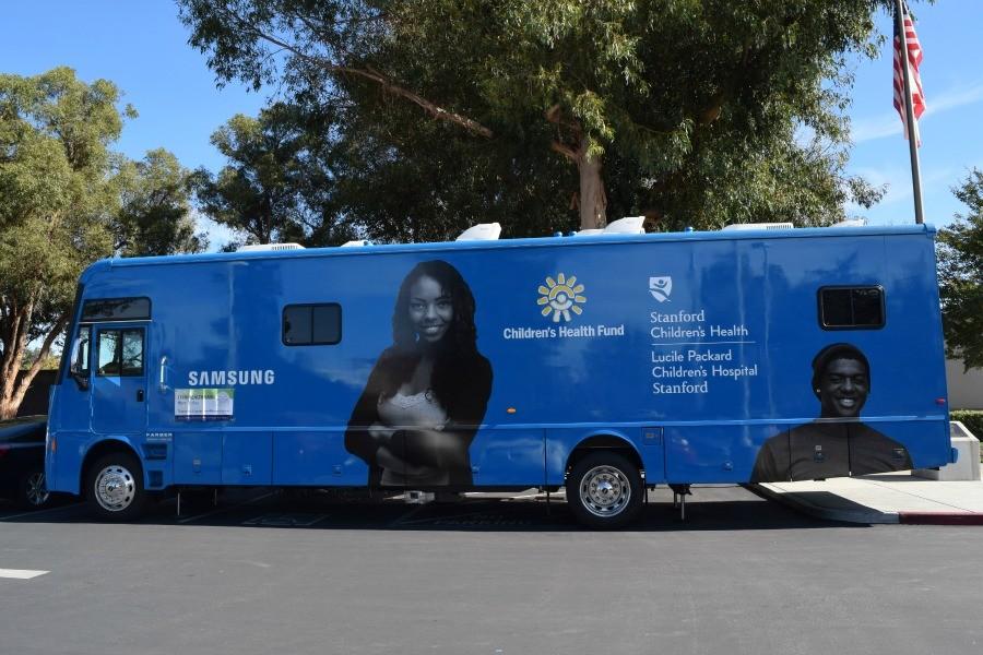 The Teen Health Van parks by the side of a road. The van, which parks at the school one Thursday each month, is a valuable resource, providing free health care to students who lack insurance coverage. Photo by Francesca Fallow.