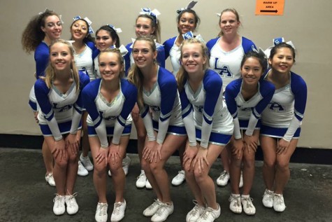 The cheer team poses after a competition at Jamz Slam City. The girls’ score was high enough qualify them for Nationals next February. Photo by Skyler Maeso.