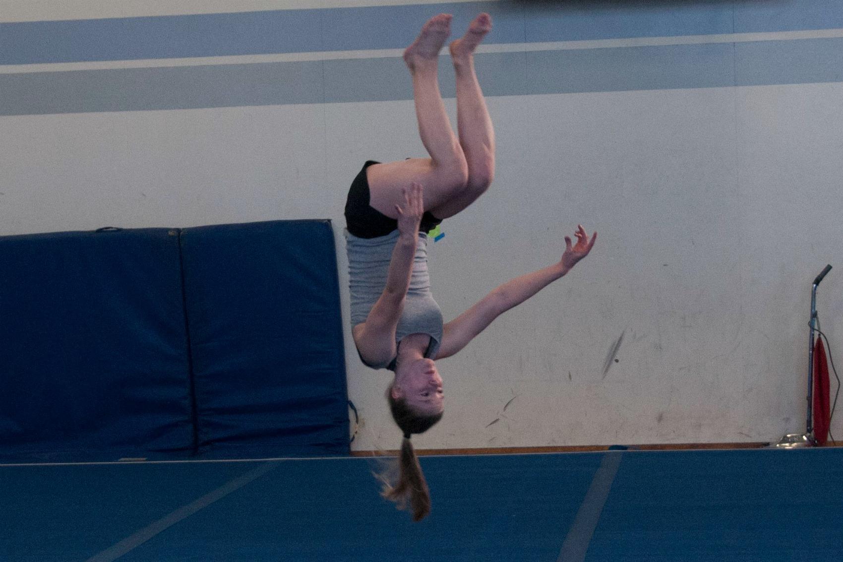 Freshman Roosa Uusitalo does a flip. Despite a lack of training space and time, the gymnastics team is ready for the upcoming season. Photo by Meilin Tsao.
