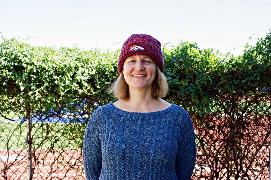 Geometry and engineering teacher Teresa Dunlap proudly sports her Broncos beanie. Dunlap has supported the Broncos since her childhood, and recently wrote a guest commentary for the Denver Post about her favorite team and Peyton Manning. Photo by Kimia Shahidi. 