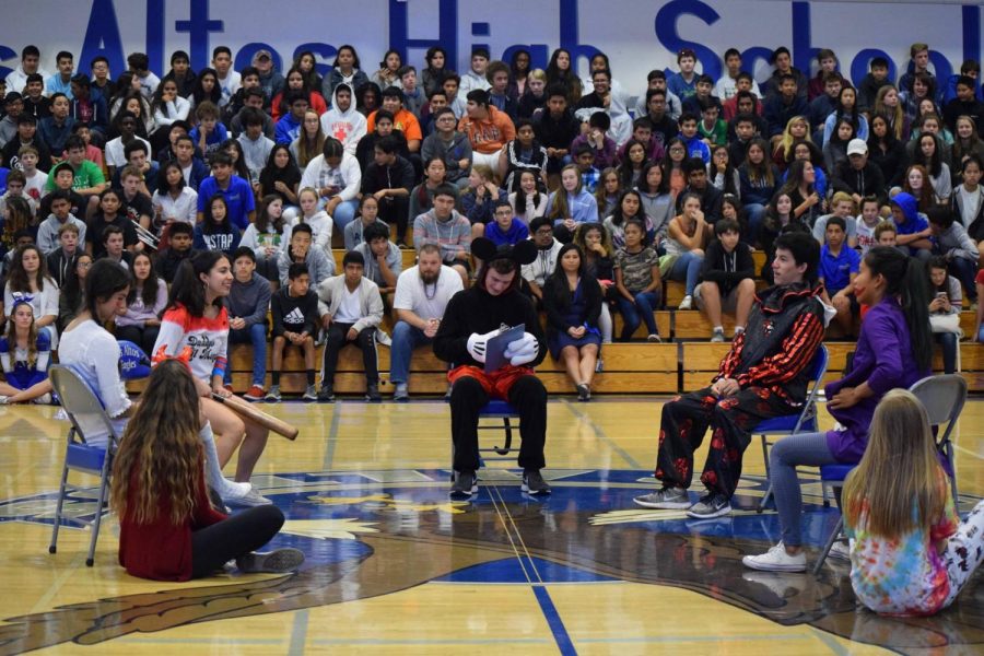 Seniors Nika Darvish, Luke Wangsness and Emilio Sanchez-Harris perform their Homecoming skit. Further festivities -- the parade and football game -- have been canceled due to air quality issues.