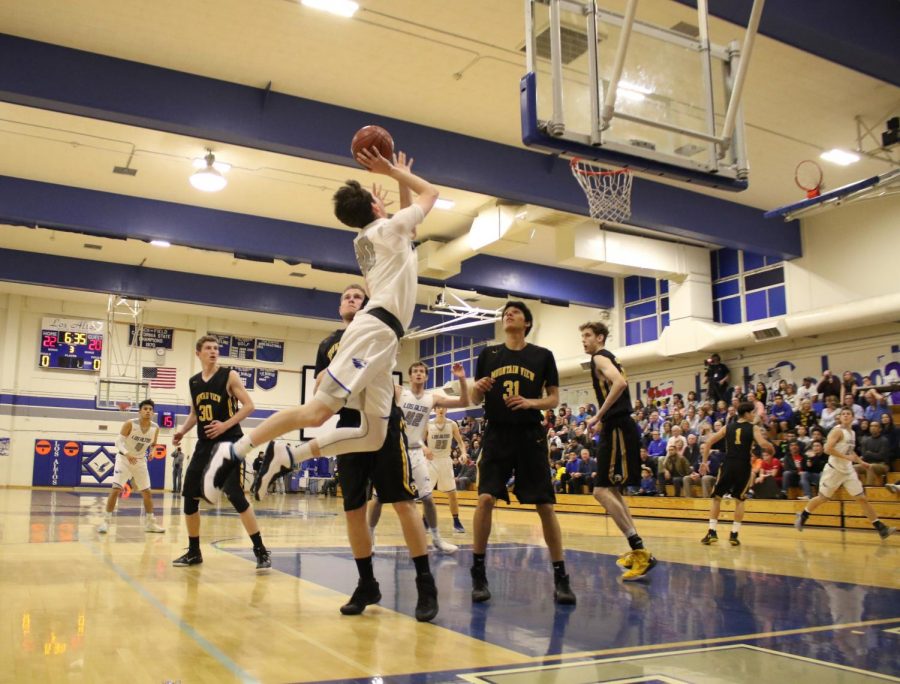 Senior Matt Eberle leaps up for a shot in Los Altos 44-35 win over Mountain View at yesterdays Senior Night game.