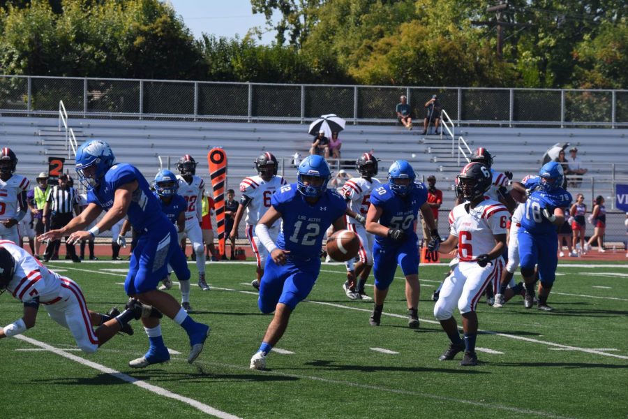 Varsity Football Dominates First League Game
