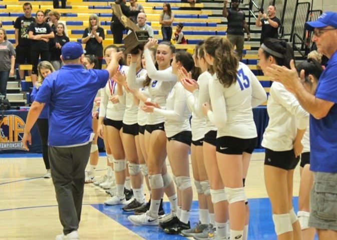 The varsity girls volleyball team after their game against Valley Christian. The 3-0 loss marked the end of the Los Altoss volleyball teams first-ever State final and a historic season.