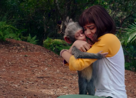 Dora, now a teenager, hugs pet monkey Boots goodbye.