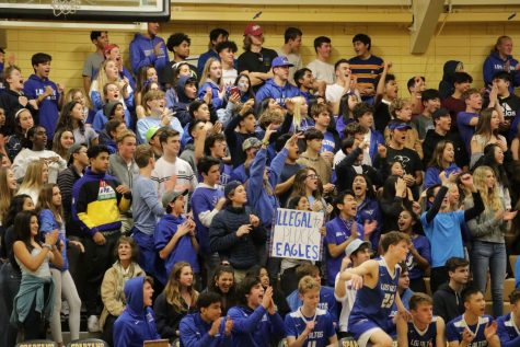 Los altos students fill the bleachers with their blue spirit and posters.
