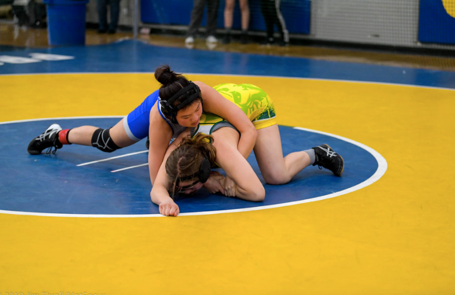 Junior Suzanne Guo attempts to flip her opponent during a meet against Prospect High School. Under head coach Jim Thrall, Suzanne and other wrestlers elevated their wrestling skills with individualized guidance. However, Thrall was dismissed mid-season on January 28.