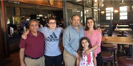 Pictured above is sophomore Omar Ibrahim with his family standing in front of one of the sites of their restaurant group, Dishdash. During quarantine, Omar has been balancing working daily with completing schoolwork. 