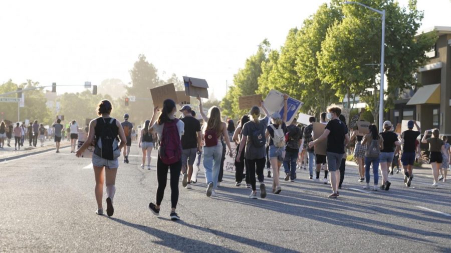 Protesters march on El Camino Real towards the intersection at San Antonio. Yesterday, protesters took to the streets of Mountain View and expressed outrage  over the killing of George Floyd by Minneapolis police officer Derek Chauvin. 