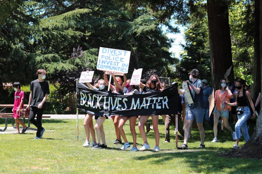 Local residents walk at the Los Altos protest against police brutality, organized by Kenan Moos, on June 5. The protest commemorated what would have been Breonna Taylors 27th birthday; Taylor was fatally shot eight times in her sleep by police in March.
