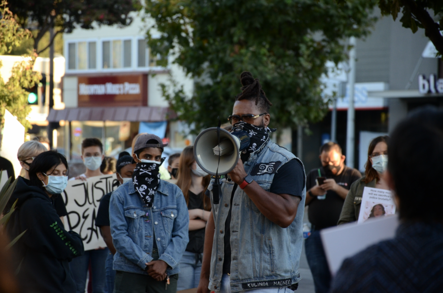 JT Faraji calls to the crowd through his bullhorn. On Friday, September 25, protesters gathered in Menlo Park, reacting to the grand jury indictment in Breonna Taylors case.