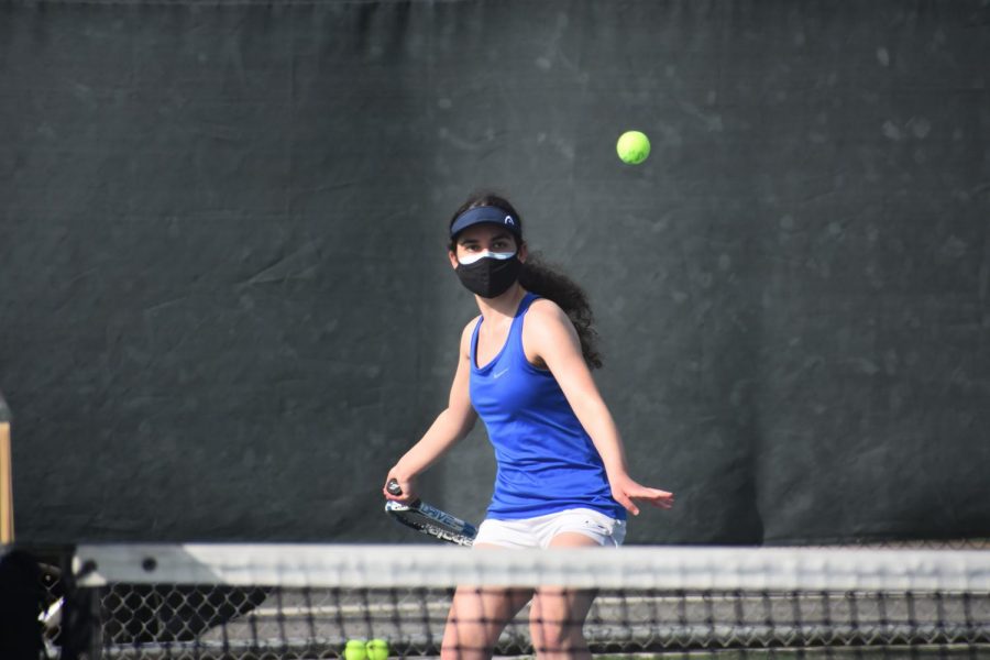 Senior Maya Atassi prepares to volley an incoming serve from her opponent. The team beat Fremont 6–1 and secured an undefeated record.