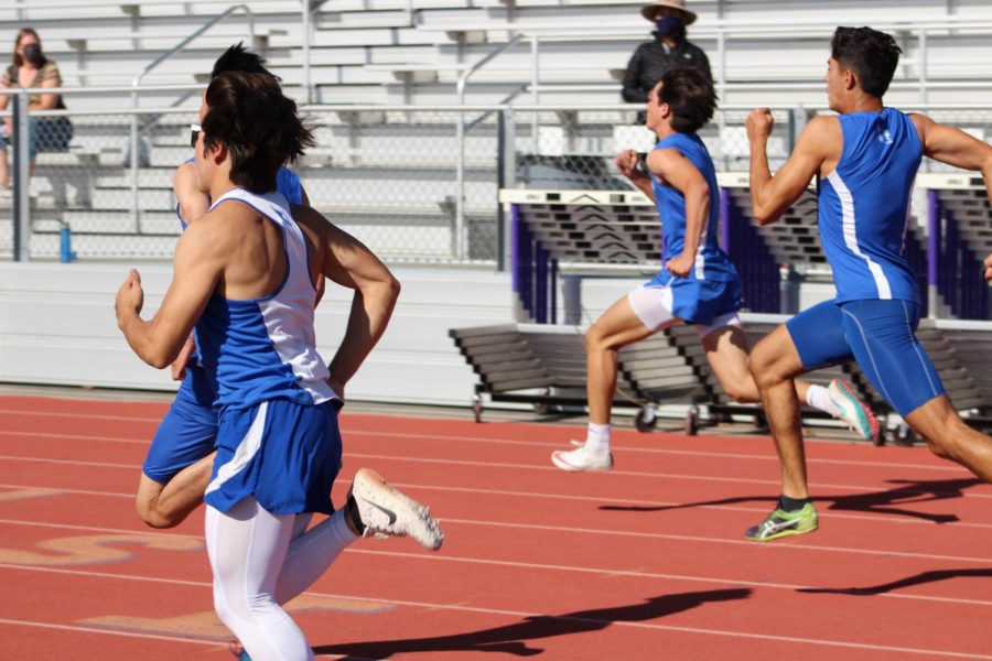 Los Altos varsity boys race in the 100-meter dash to mark the beginning of the pentathlon. Throughout the pentathlon, athletes competed in a 100-meter dash, shot-put, long jump, high jump and a 400-meter race, with senior Jimmy Dessouki winning for the boys and sophomore Megan MacKenzie winning for the girls.