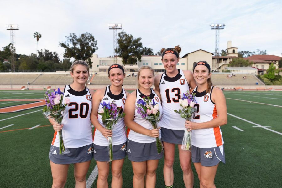 Sabin (center) is pictured with some of her fellow teammates at Occidental College. She played four years of lacrosse in college and is excited to share the lessons she has learned through her time as a player and her visions for the upcoming season this Spring with the rest of the LAHS team. 
