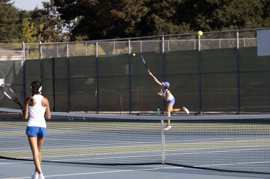 Senior Rose Liu serves during a doubles match against Mountain View High School. Due to limited court space at Mountain View High School, MVHS is sharing court space with the Los Altos High School girls tennis team, leaving the Eagles with little practice time.
