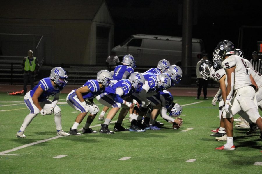 The Los Altos football team prepares for a snap. The Eagles ultimately lost 56–35 against the Sharks of St. Francis Salesian College Preparatory, capping off their season.