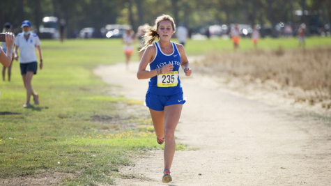 Senior Riley Capuano runs on the Baylands Park course in the first SCVAL meet of the 2021 season. 