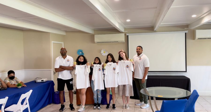The four winning team members hold their prizes alongside Executive Director of the YES program Professor Ernest Ruffin, Jr. (far left). (Naidely Gonzalez-Herrera pictured to the left of students; Diana Suvorova pictured to the right of students)