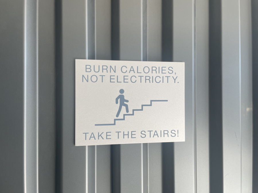 A sign that reads, Burn calories, not electricity, is posted near the stairs of the 600s building. This sign has caused a lot of controversy amongst students, and prompted some students to speak out in favor of its removal. 