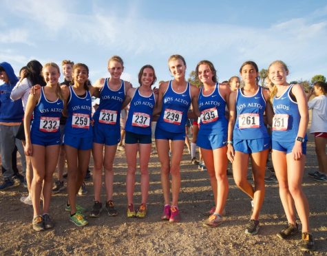 The varsity girls cross country team poses for a group photo after running a record-breaking race on the Crystal Springs course at their second SCVAL meet. 