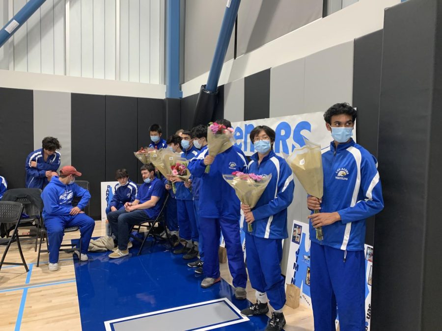 Los Altos High School senior wrestlers pose for a photo before competing against Mountain View High School on senior night. 
