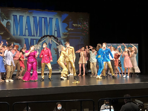 The cast of Mamma Mia rehearses for the musical that runs February 3rd, 4th, and 5th. Putting on the production required cast members to play multiple roles, from actors to choreographers to costume designers.