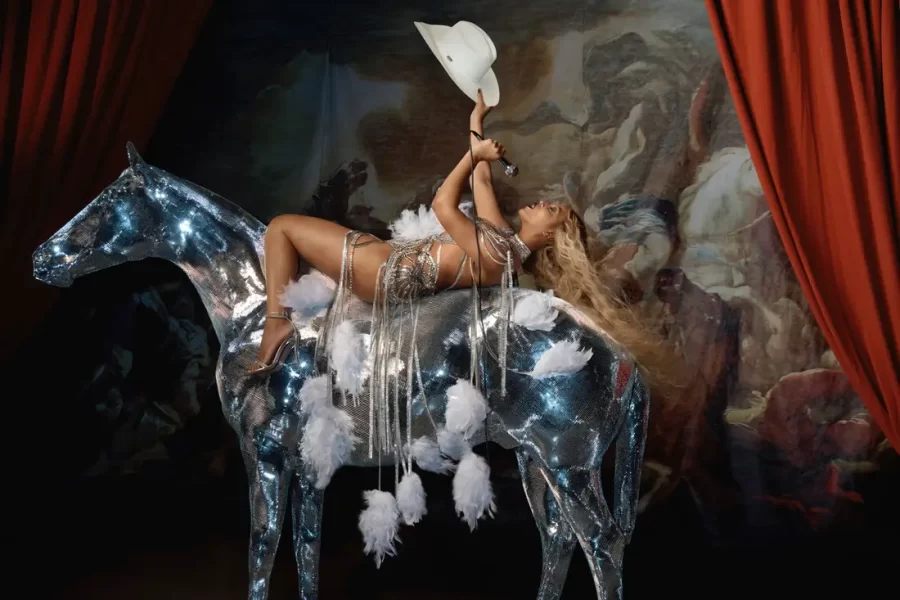 Beyonc%C3%A9+Knowles-Carter+reclines+on+a+transparent+horse+in+front+of+a+Renaissance-style+painting+while+singing+into+a+microphone.+Beyonc%C3%A9s+latest+album%2C+released+July+29%2C+2022%2C+is+escapism+at+its+finest%2C+combining+house%2C+disco%2C+soul+and+R%26B+influences.