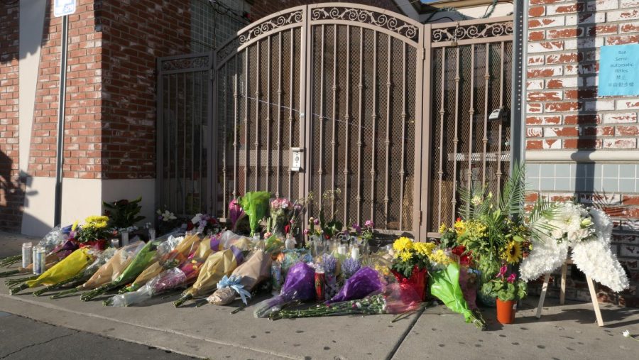 Flowers are laid outside the dance studio where the Monterey Park shooting occurred as a memorial to the deceased. This was one of seven mass shootings that took place in California this month.