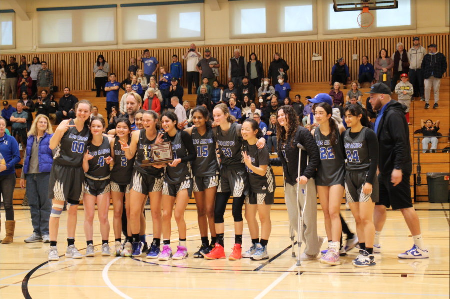 The varsity girls basketball team poses for a team picture as the CCS Division I runner-up.