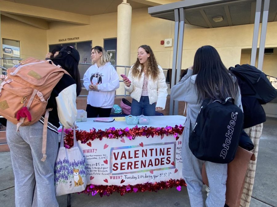 Eager faces meet smiling ones as choir members spend time selling Valentine’s serenades after school to an excited crowd.