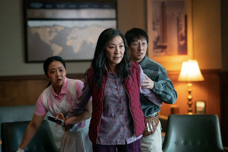 Evelyn Wang stands in front of her husband, Waymond Wang, and her daughter, Joy Wang, to protect them from an unseen danger.