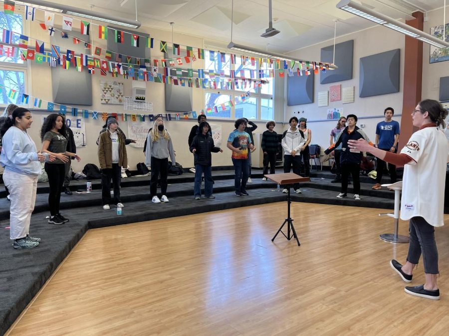 Volare practices singing together during class. They are preparing for their Europe trip this summer where they will have multiple performances.