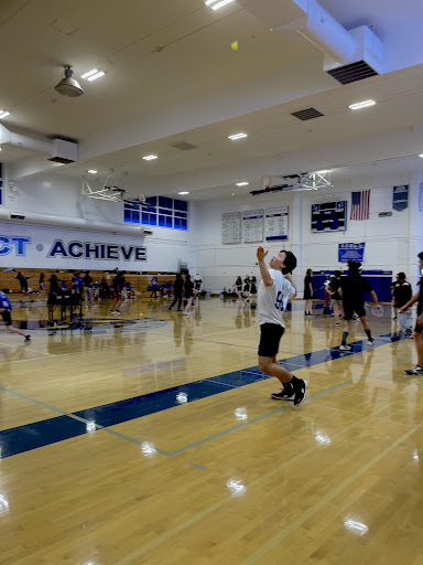 Team captain junior Ben Xu warms up for his last game this season against Mountain View High School. The rivalry game ended in a loss of 10–20.