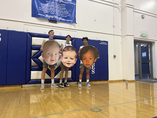 After a successful win, seniors Tyler Cairns (left), Zach Schuder (middle) and Ethan Choe (right) pose with their baby photos in honor of senior night. The Talon has confirmed their baby photos are not to scale.