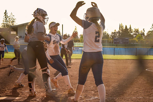 Senior Kaitlyn Smiley celebrates after scoring the game-winning run. 