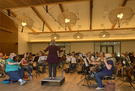 Founder, director and conductor Cathy Humphers Smith conducts TACO in the Grand Oak Room at the Los Altos Community Center. 