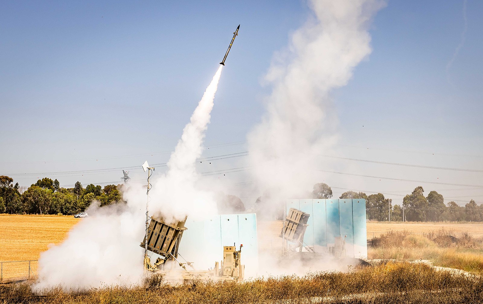 Israeli defense system, Iron Dome, launching a missile to intercept an enemy rocket headed toward civilian areas.