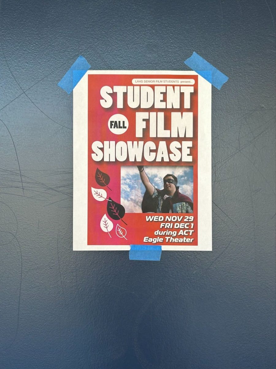 A+poster+of+the+Student+Fall+Film+Showcase+on+the+door+of+the+Eagle+Theater.