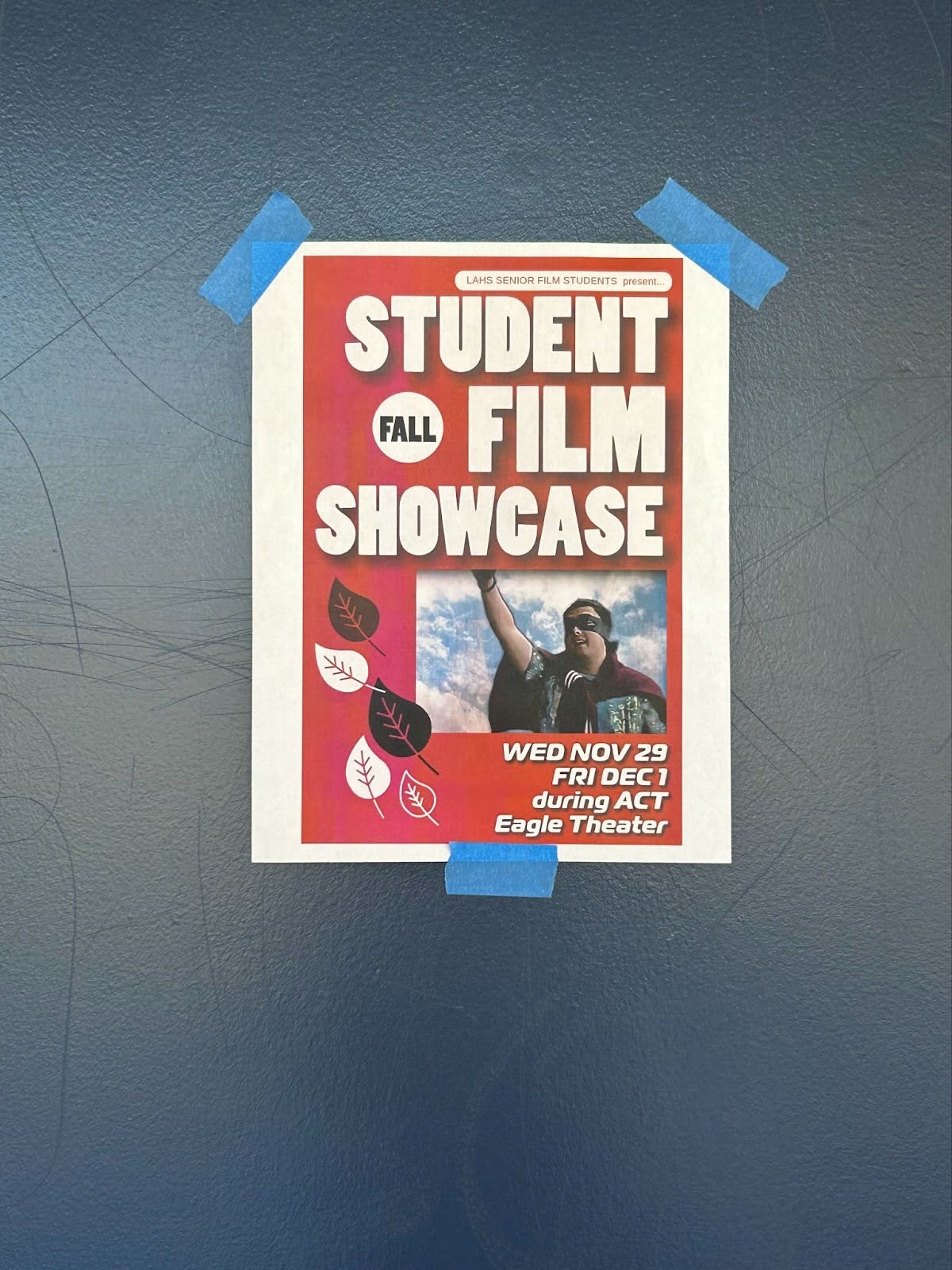 A poster of the Student Fall Film Showcase on the door of the Eagle Theater.