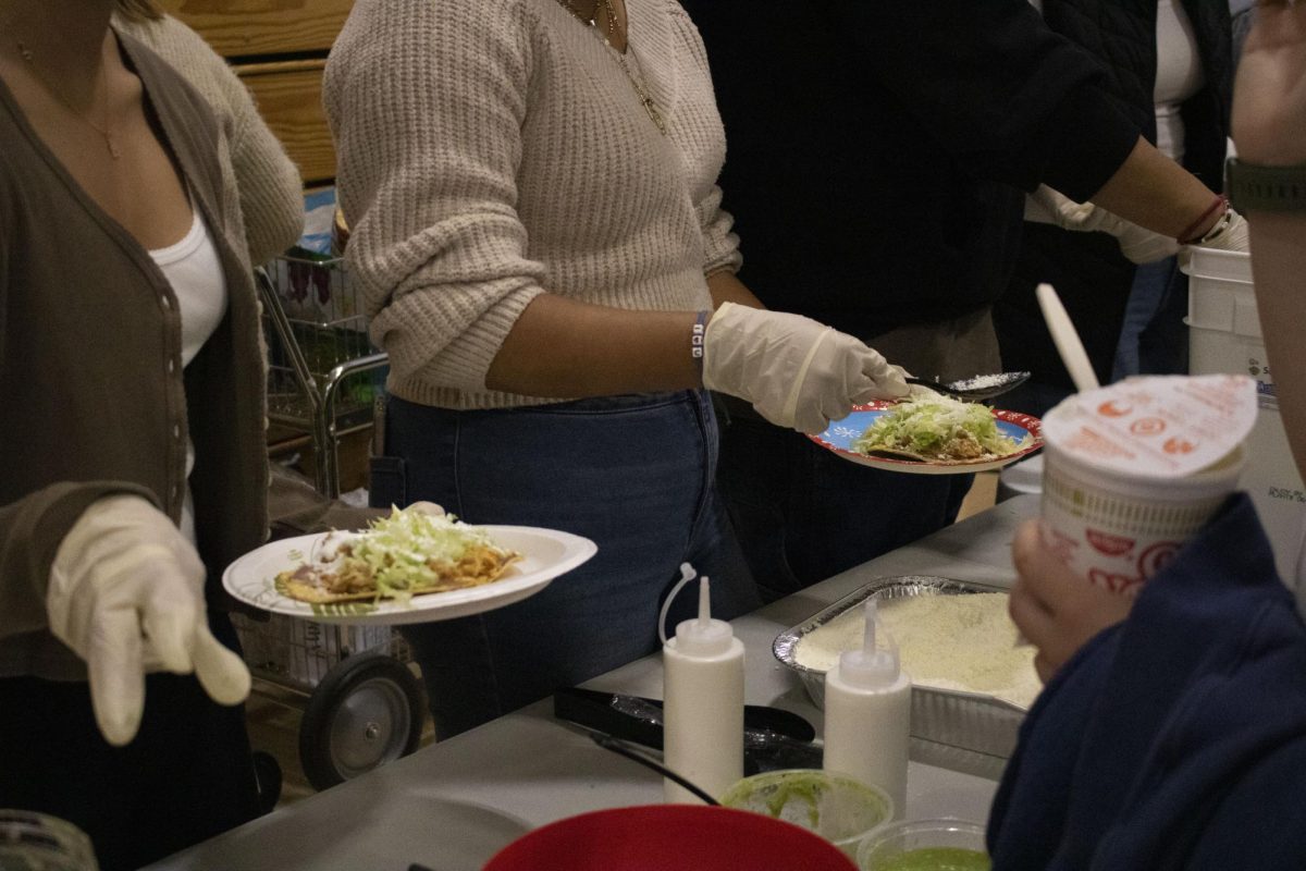 Latino Student Union’s booth serves tostadas with toppings.