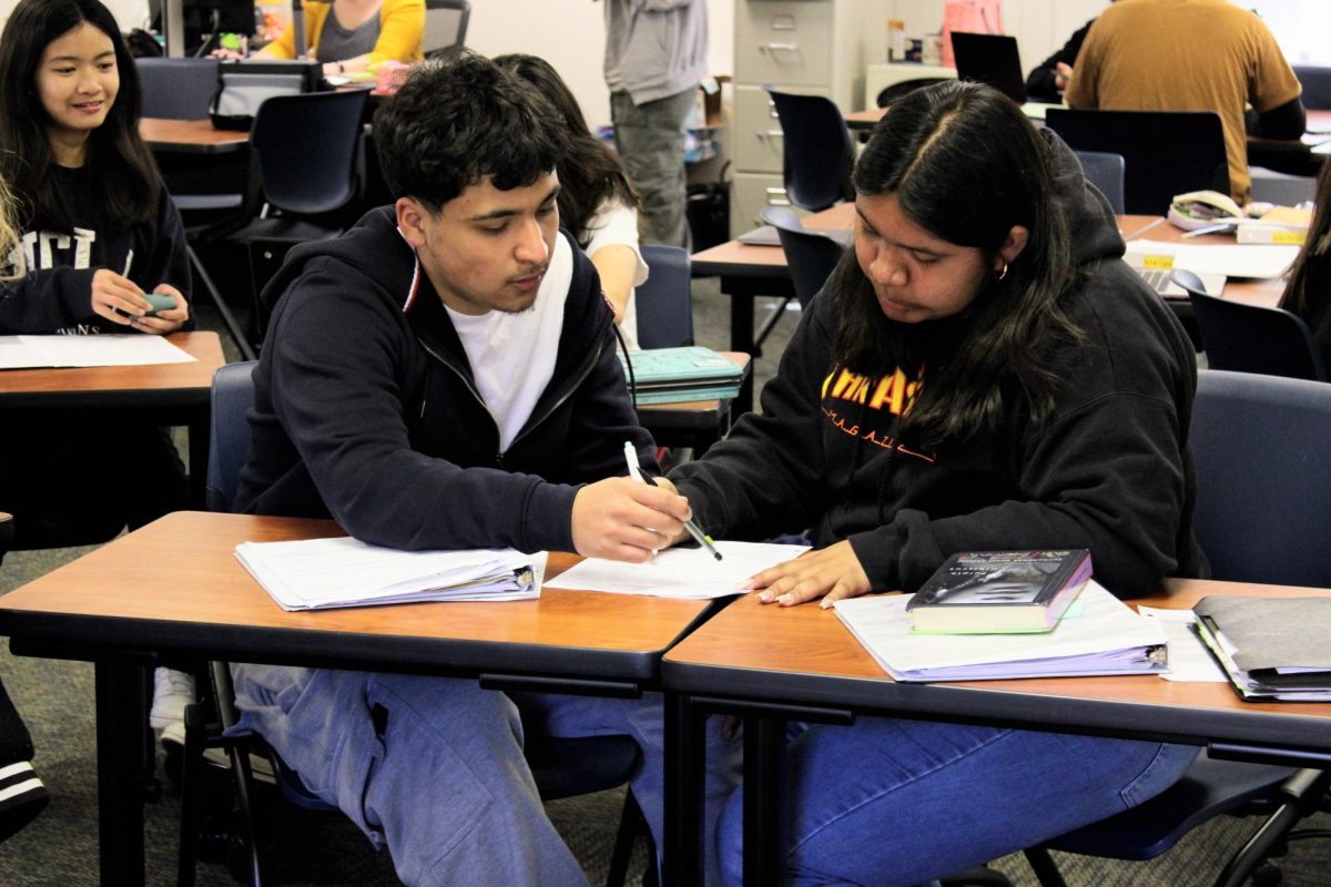 Two AVID students work together on English during tutorial time.