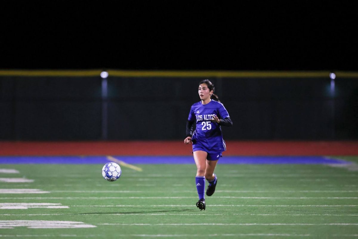 Freshman+Selya+Sen+dribbles+the+ball+down+the+soccer+pitch.+Last+winter%2C+she+was+one+of+two+freshmen+who+made+the+LAHS+varsity+team.+