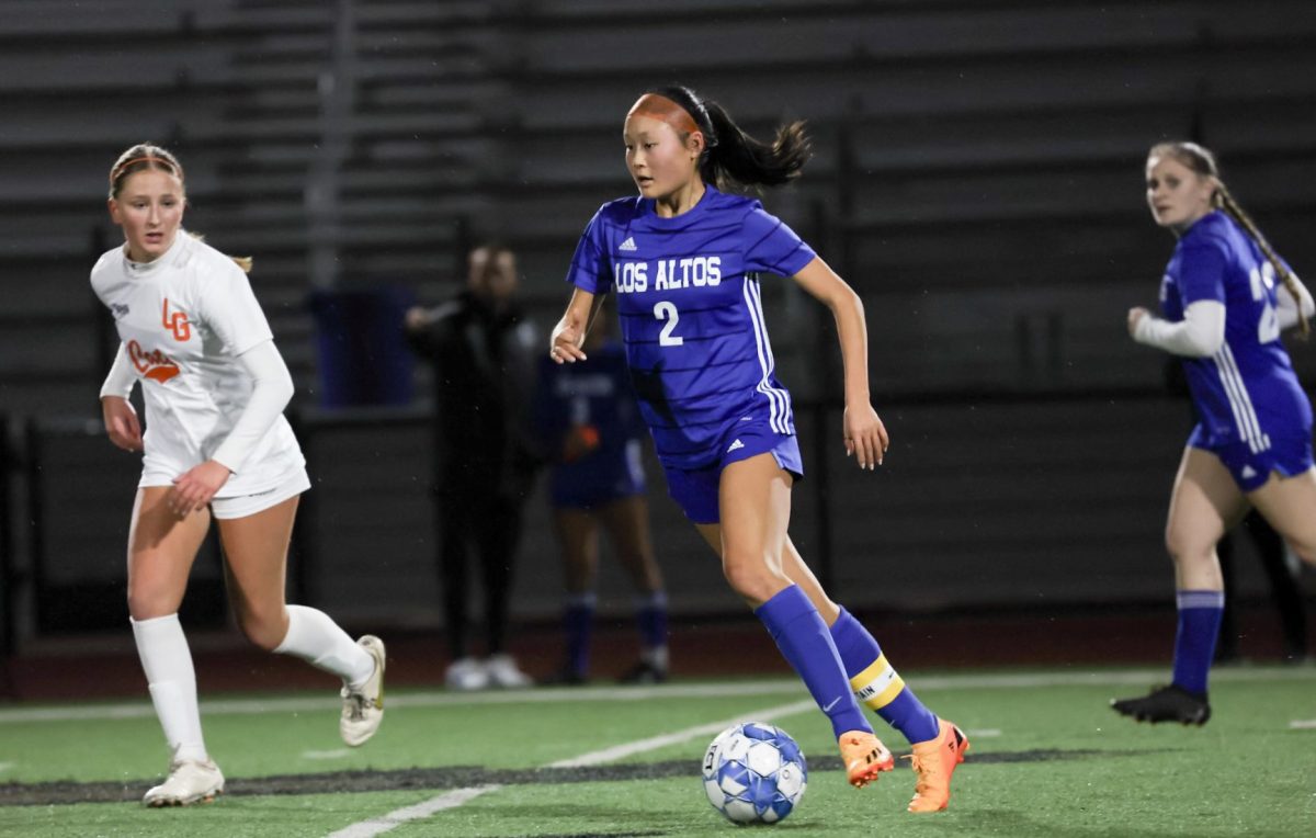 Junior Anya Lin dribbles the ball down the field. This March, Anya announced her commitment to University of California San Diego for Division I soccer. 